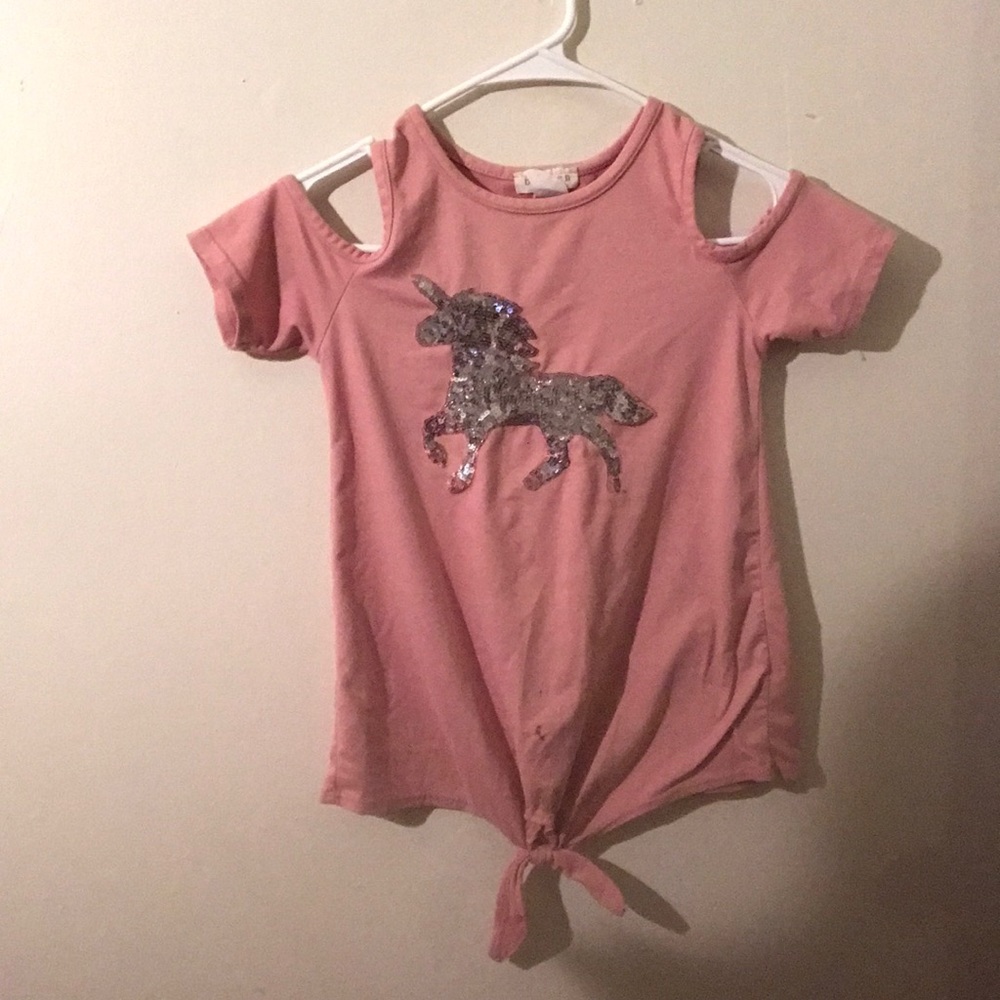 Blush cold shoulder blouse with shiny unicorn .